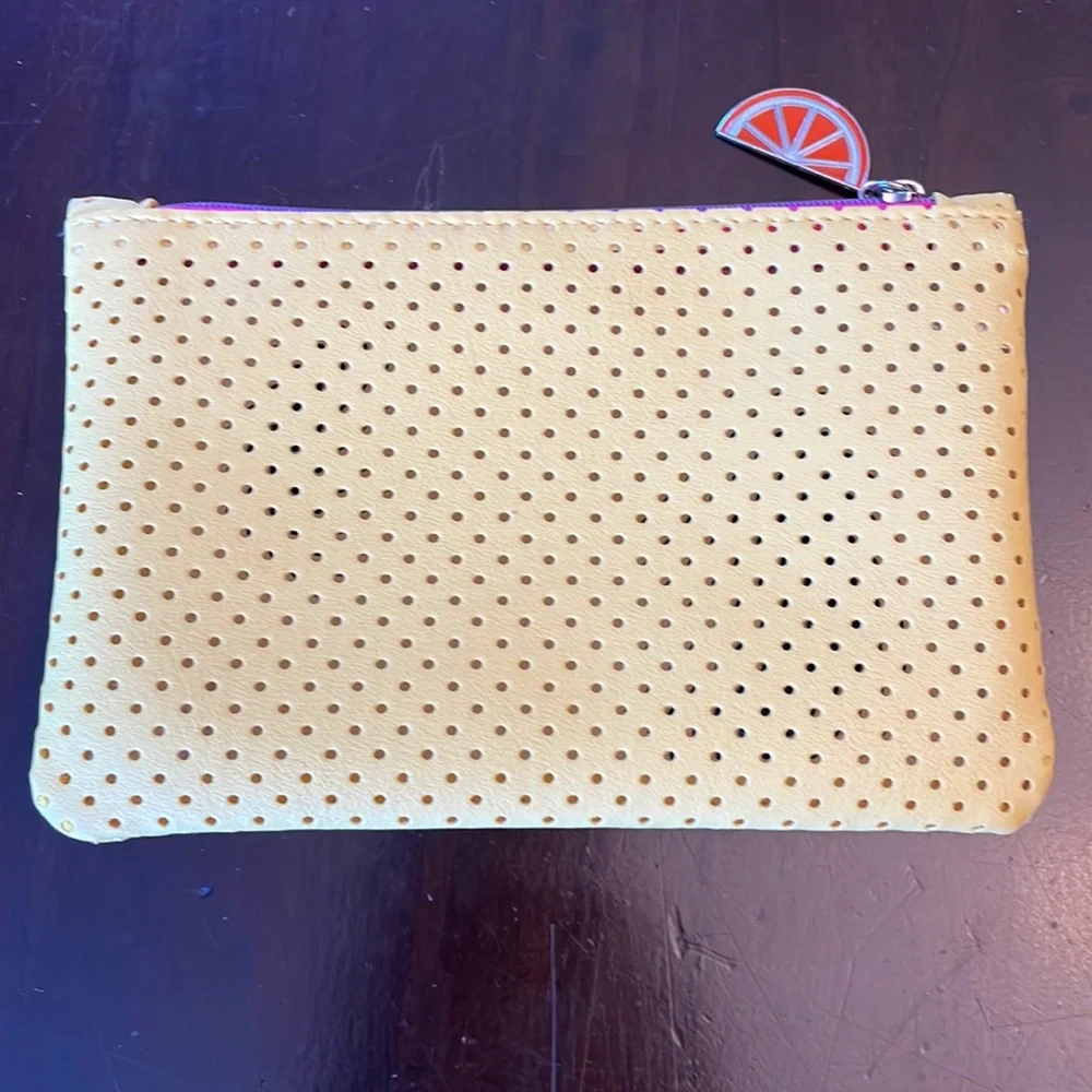 Ipsy make up bag with mail bundle.